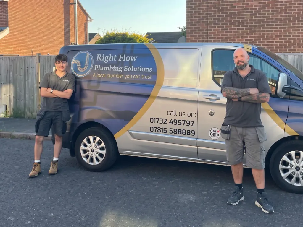 Two Right Flow Plumbing Solutions engineers standing beside their branded van
